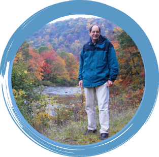 Ed Bouwer public health practice Smiling man, standing outdoors in front of bay